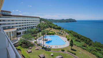 Seasonal outdoor pool, open 9:00 AM to 6:00 PM, pool umbrellas