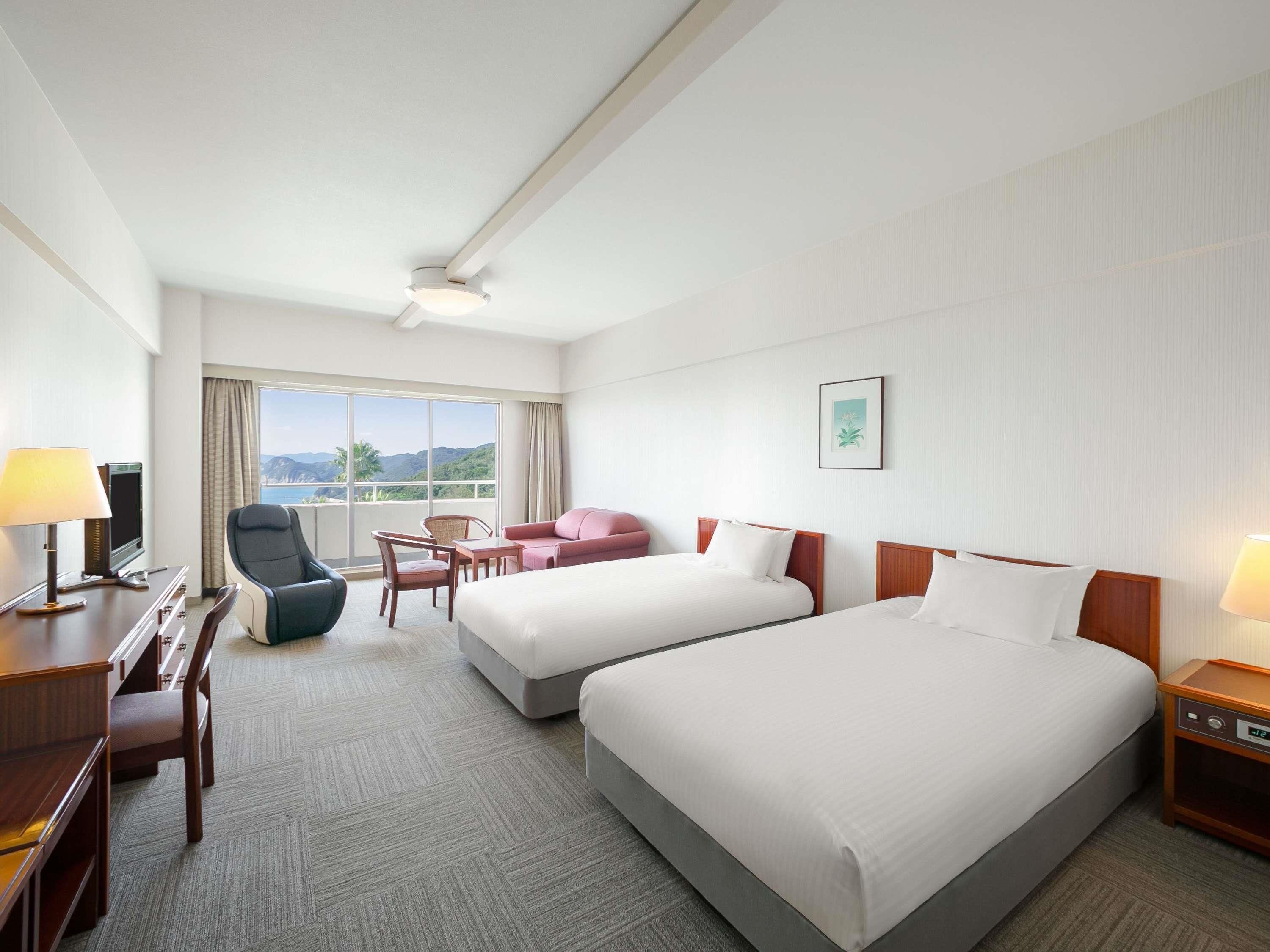 Desk, iron/ironing board, bed sheets