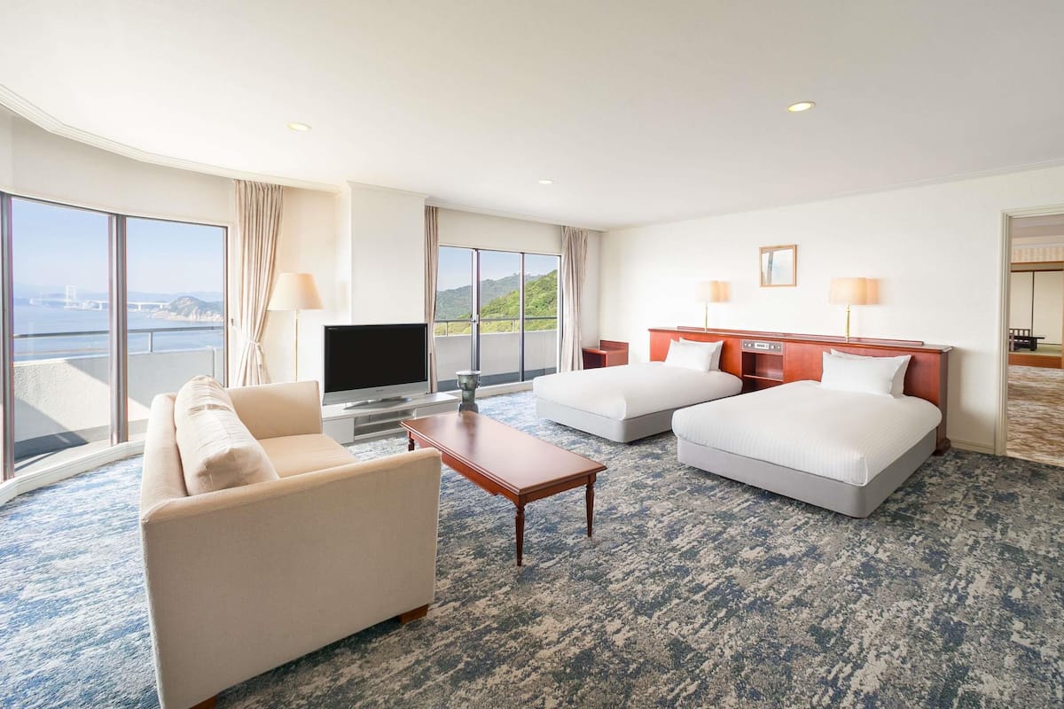 Deluxe Suite, Multiple Beds, Sea View | Desk, iron/ironing board, bed sheets