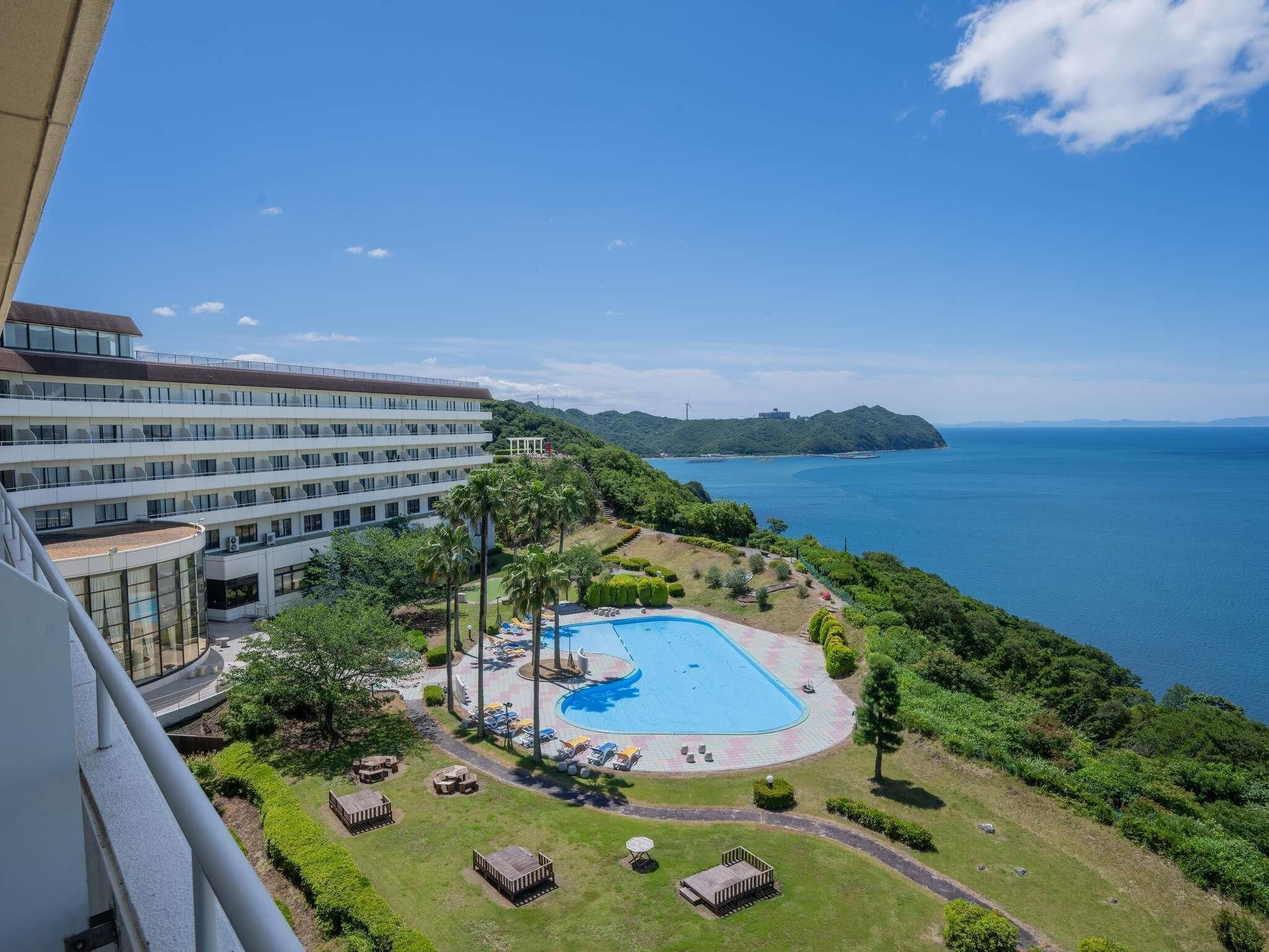 Seasonal outdoor pool, open 9:00 AM to 6:00 PM, pool umbrellas