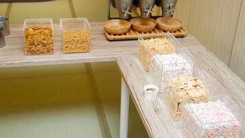 A snack display with various food items in clear containers.