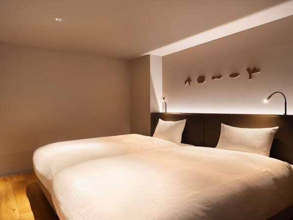 Suite júnior, 2 llits individuals, vistes a l'oceà | 2 dormitoris, caixa forta a l'habitació, wifi gratuïta i roba de llit 