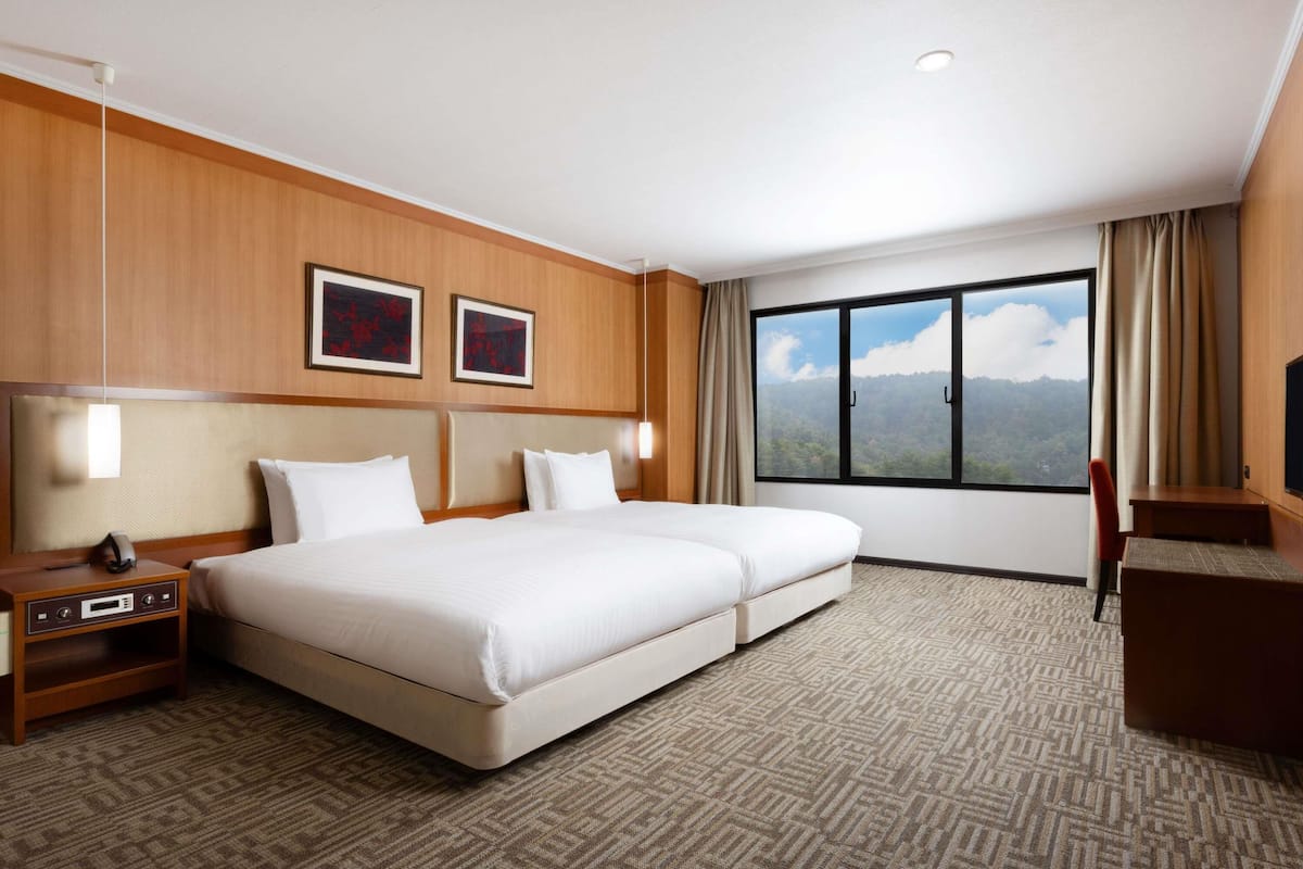 privilege, deluxe suite, multiple beds | premium bedding, in-room safe, desk, blackout curtains