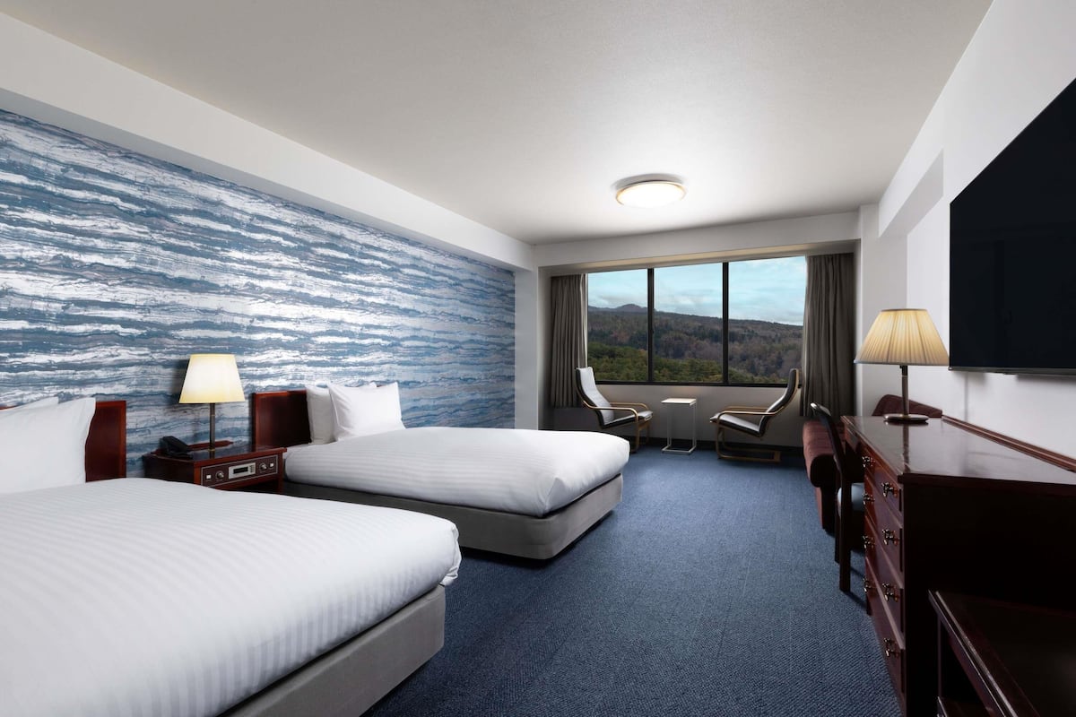 standard triple room, multiple beds, sea view | premium bedding, in-room safe, desk, blackout curtains