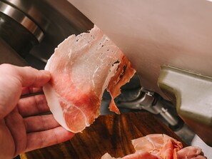 A chef's kitchen essentials at your fingertips, with a cutting board and sink nearby.
