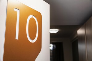 A hallway with a sign displaying the number '10'.