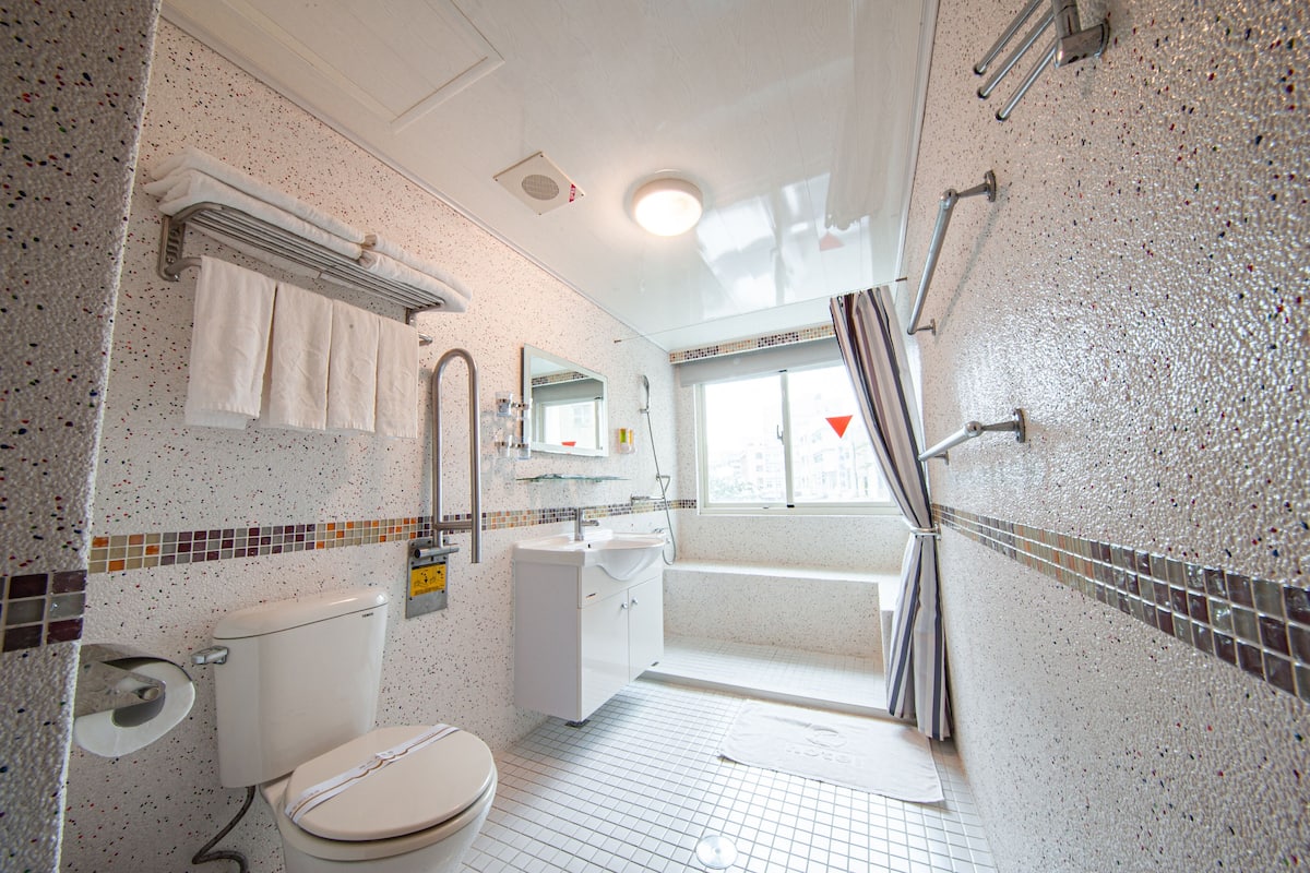 traditional suite | bathroom | hair dryer, towels, shampoo, toilet paper