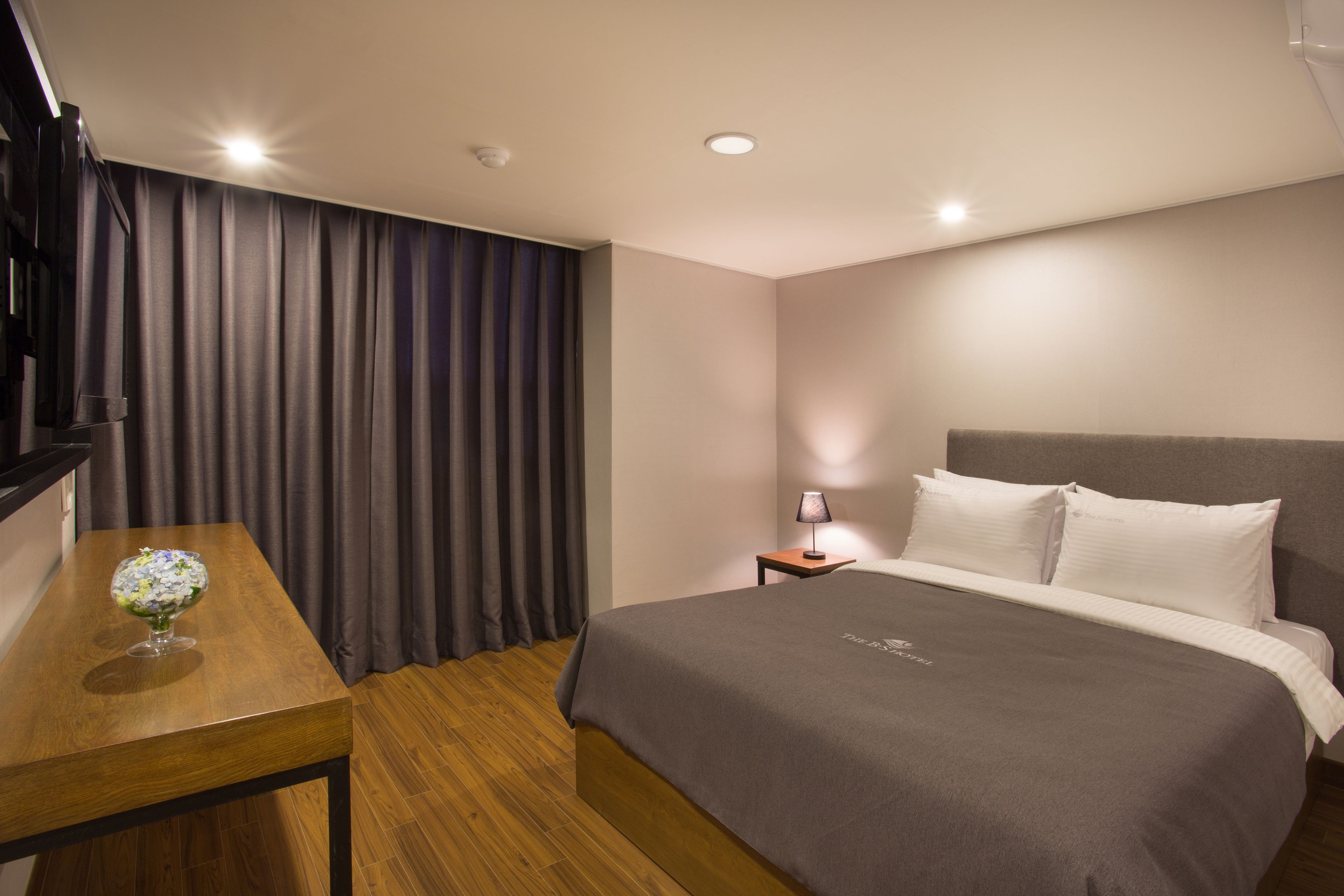 premium bedding, desk, blackout curtains, soundproofing