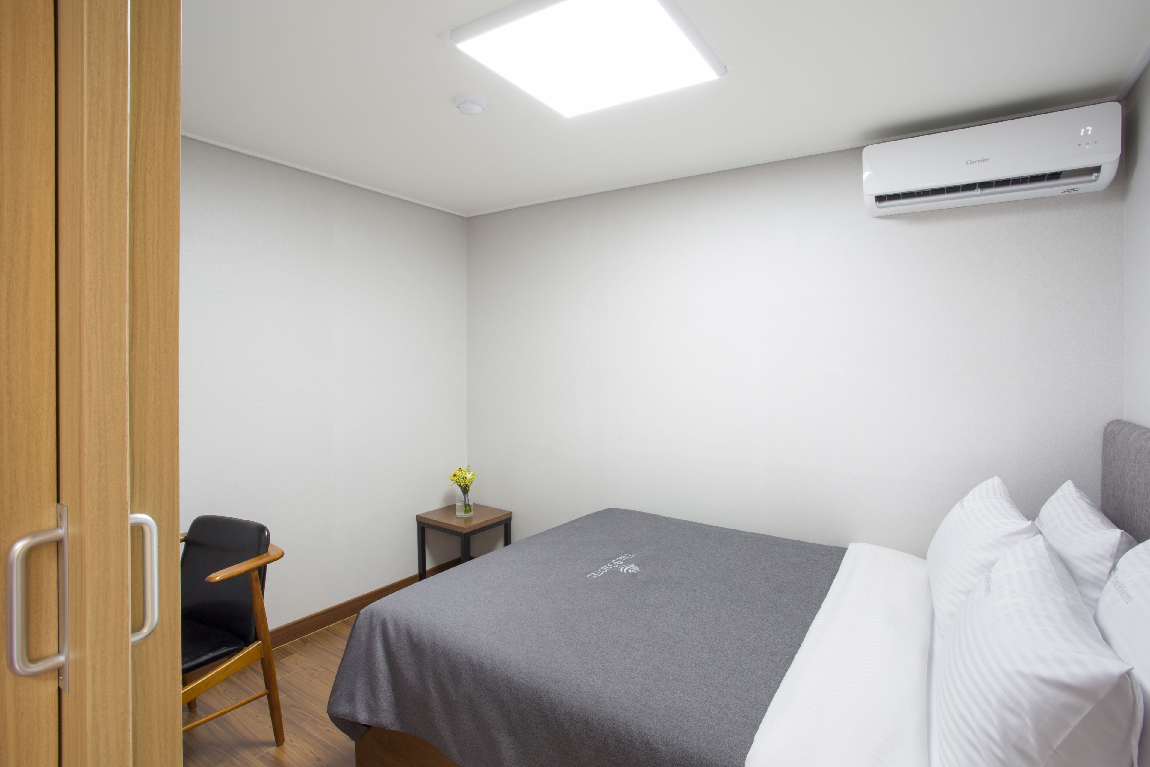 premium bedding, desk, blackout curtains, soundproofing