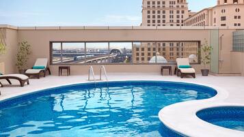 Outdoor pool, pool umbrellas, sun loungers