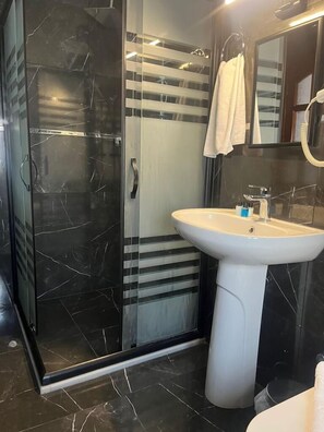 Shower, free toiletries, hair dryer, slippers