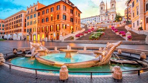 A historic square with a central fountain, a grand staircase leading to a church, and classical architecture. - Residenza al Corso (Rome)