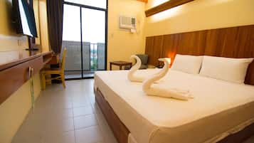 Queen Room with Balcony | 1 bedroom, desk, blackout curtains, rollaway beds