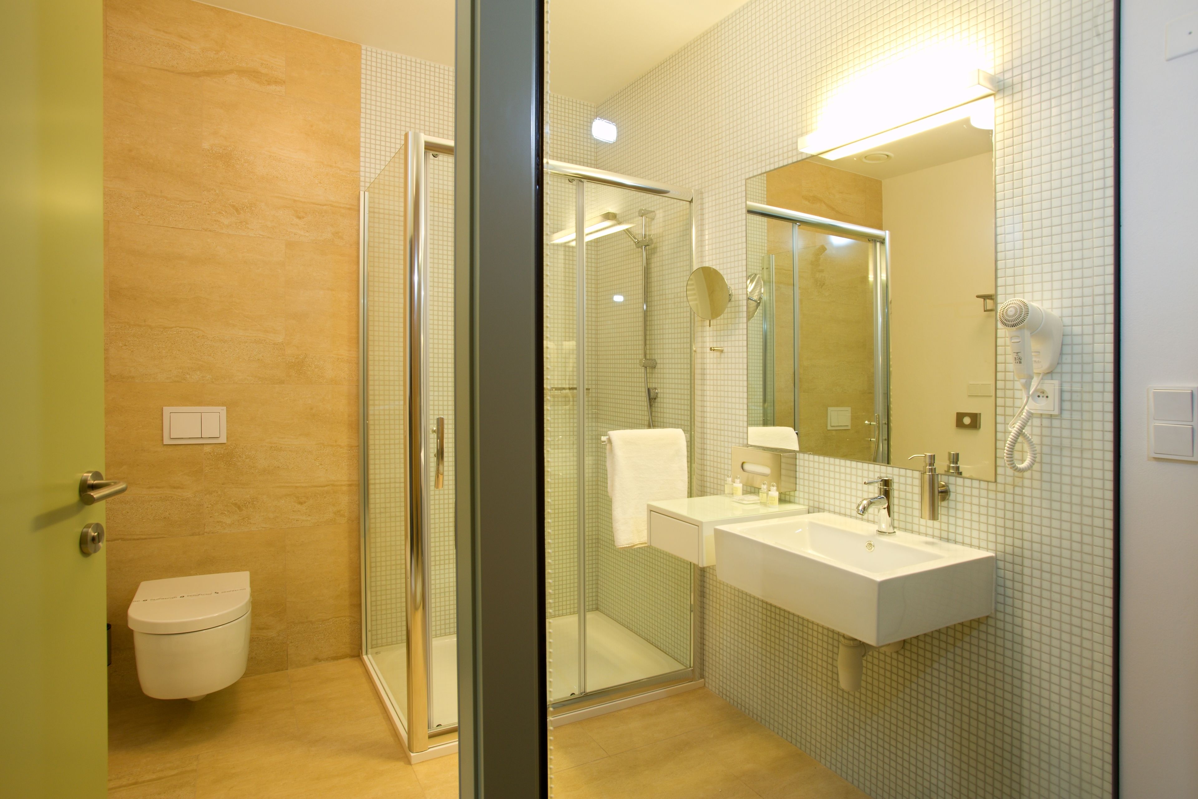 shower, rainfall showerhead, hair dryer, towels