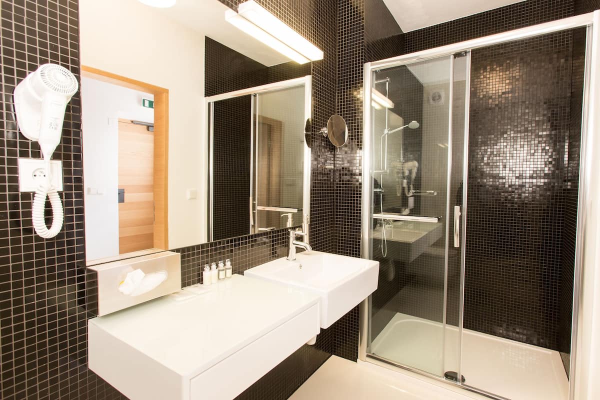 shower, rainfall showerhead, hair dryer, towels