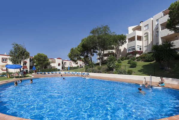 Outdoor pool, pool umbrellas, pool loungers