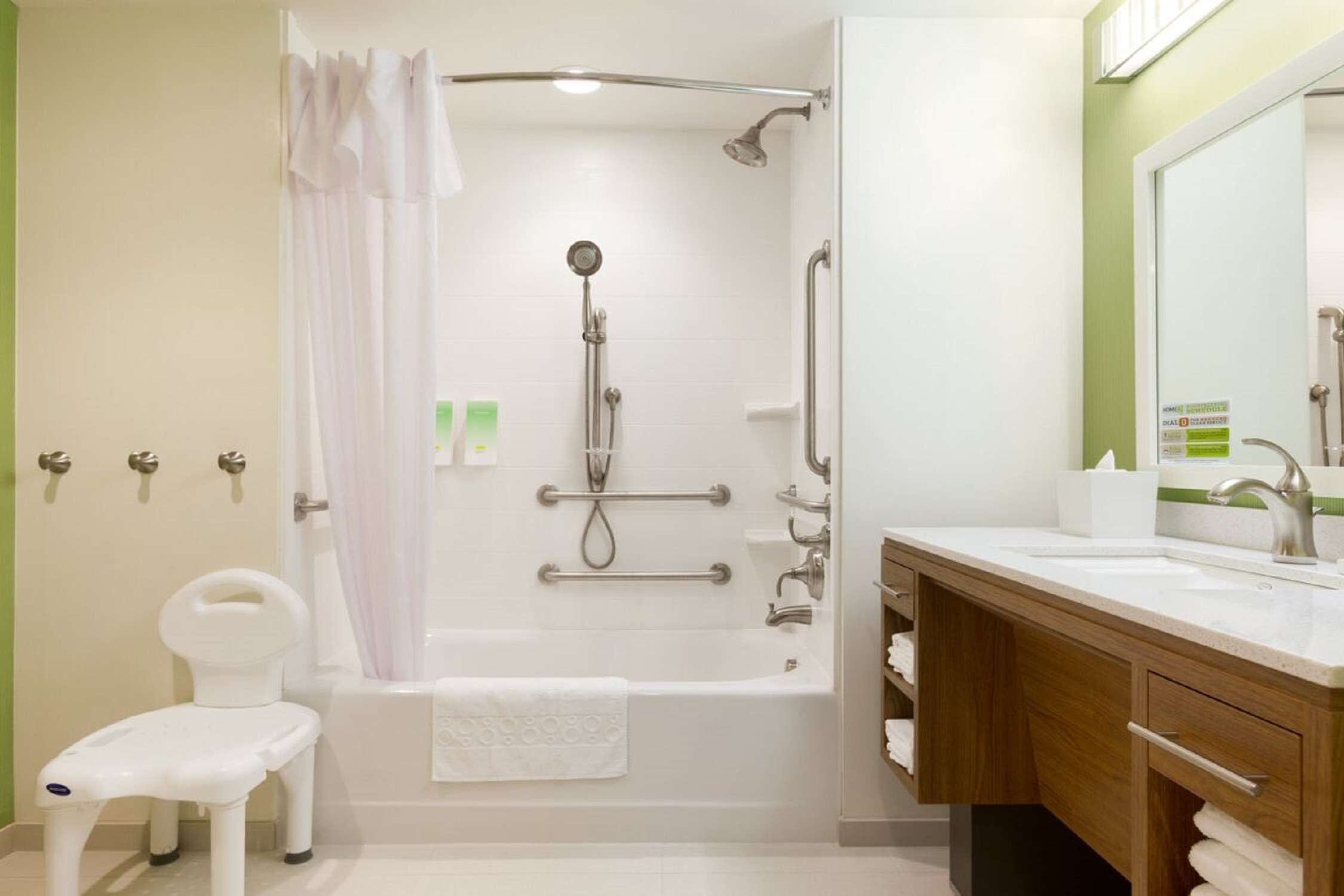 queen studio bathtub accessible | bathroom | hair dryer, towels