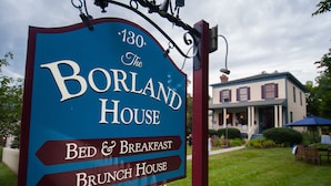 A sign for The Borland House, a bed and breakfast offering breakfast and brunch. - Borland House Inn (Montgomery)