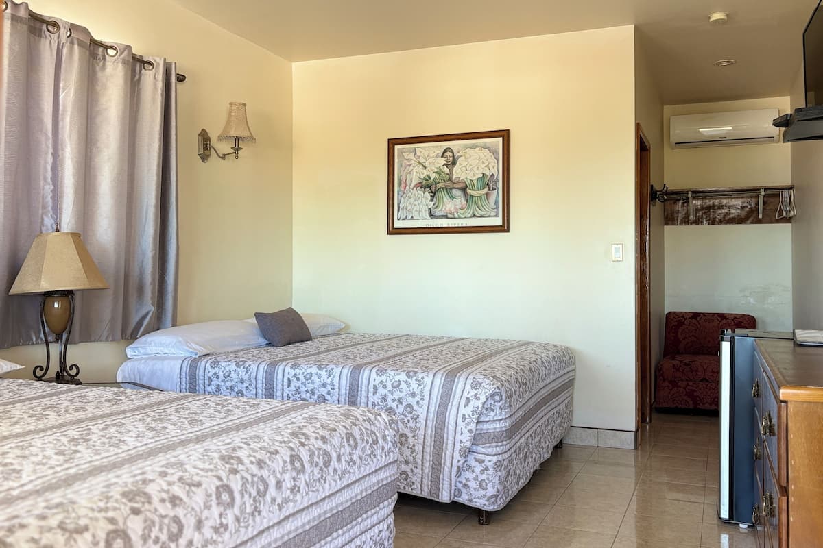 Basic Single Room, Two King Beds | Individually decorated, individually furnished, blackout drapes