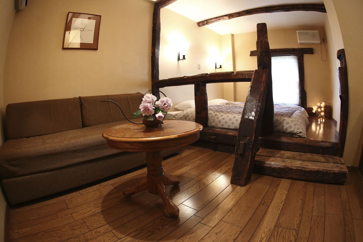 woody twin with shared bathroom | living area | lcd tv