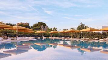 Seasonal outdoor pool, open 10:00 AM to 6:00 PM, pool umbrellas