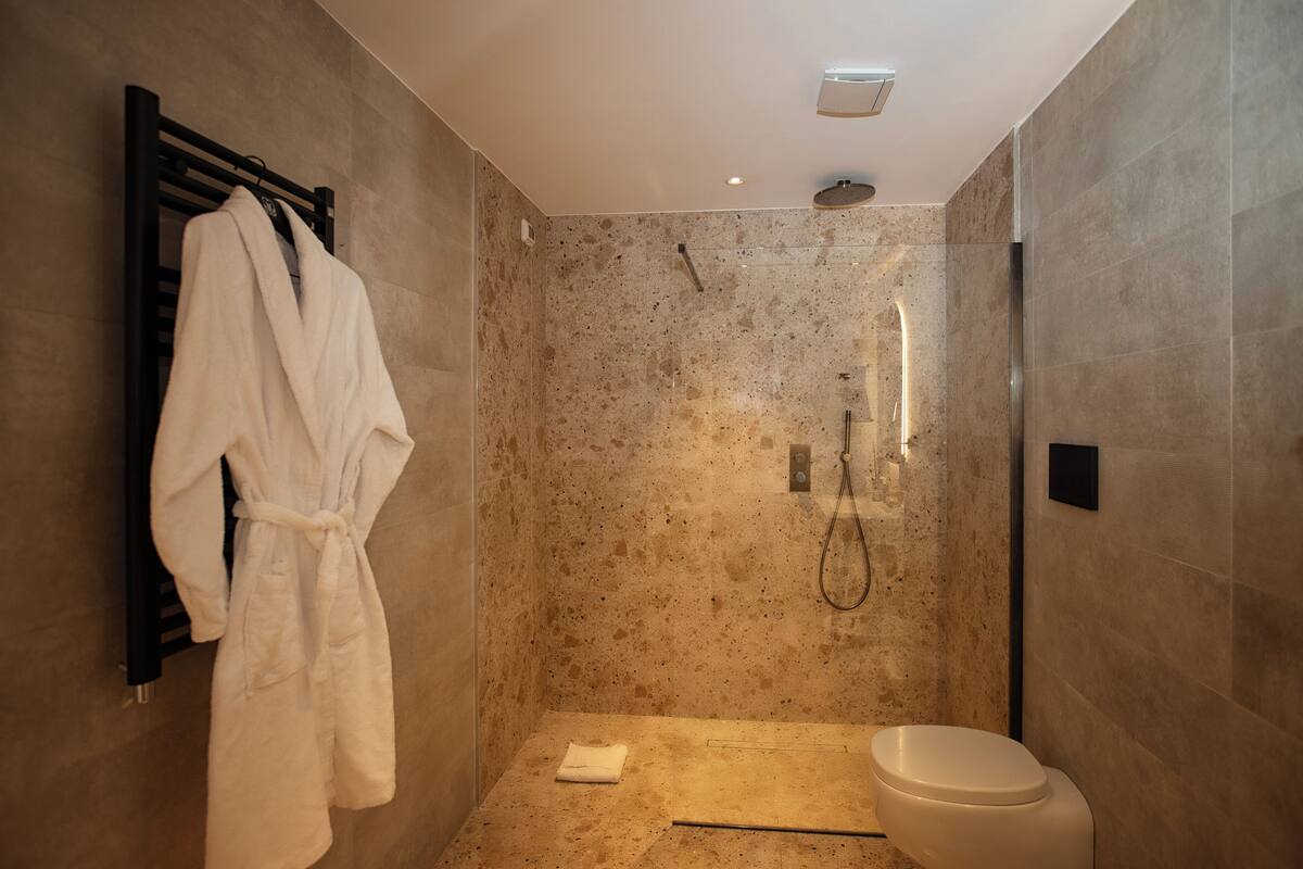 shower, rainfall showerhead, designer toiletries, hair dryer