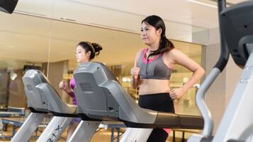 A gym with treadmills and exercise equipment.