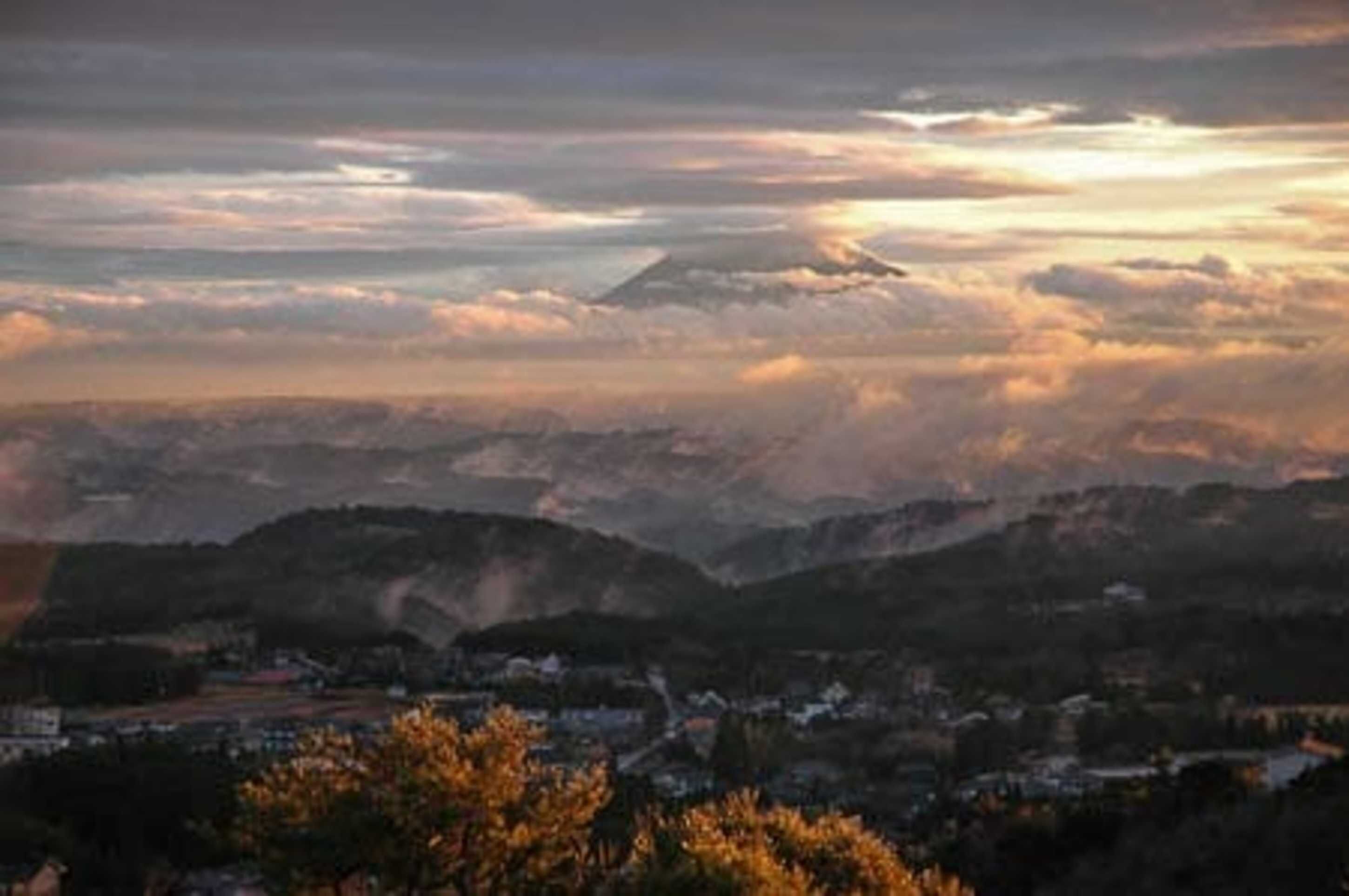 A mountainous landscape with a town in the valley.