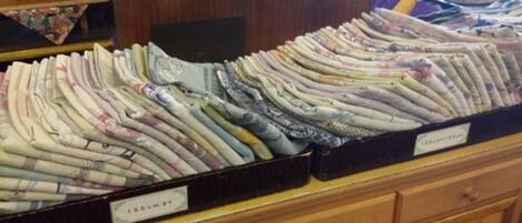 A display of neatly folded bedding in a store.