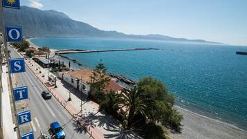 On the beach, sun loungers, beach umbrellas, beach towels