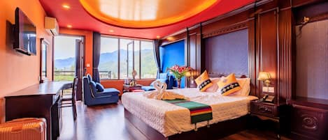 Deluxe Triple Room, Balcony, City View | Minibar, in-room safe, individually decorated, desk