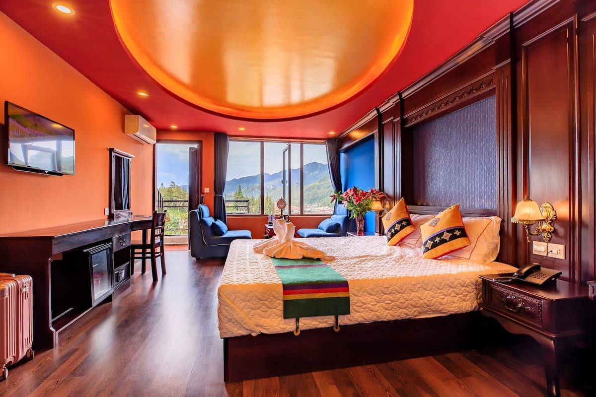 Deluxe Triple Room, Balcony, City View | Minibar, in-room safe, desk, blackout curtains