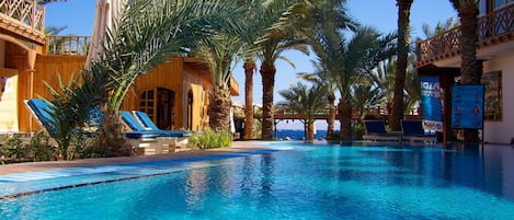 Outdoor pool, pool umbrellas, sun loungers
