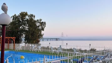 Seasonal outdoor pool, open 9:00 AM to 10 PM, pool loungers