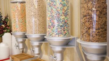 A cereal dispenser with multiple containers filled with different types of cereal.