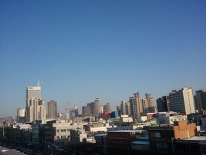 A cityscape with various buildings, including high-rise and mid-rise structures. - Cheonggye Haus (Seoul)