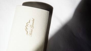 A cylindrical object with a textured surface and a label that reads "Hotel Garabal."