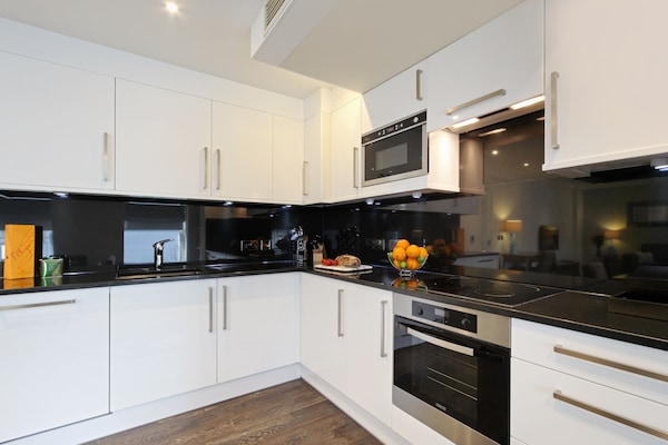 Three Bedroom Deluxe | Private kitchen | Full-size fridge, microwave, oven, stovetop