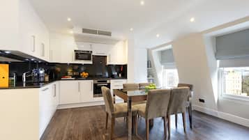 Three Bedroom Penthouse Apartment | Private kitchen | Full-size fridge, microwave, oven, stovetop