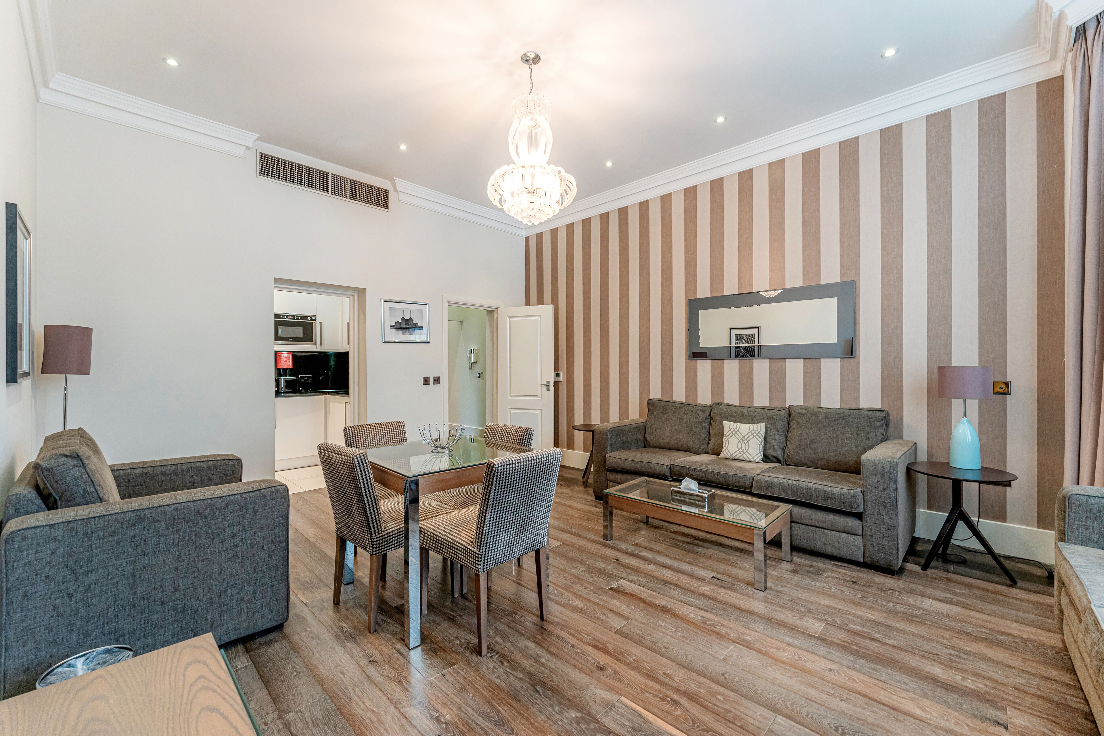 Deluxe One Bedroom Apartment | Living area | LCD TV, DVD player