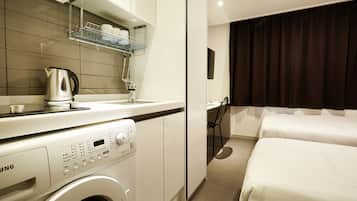 Desk, laptop workspace, blackout curtains, iron/ironing board