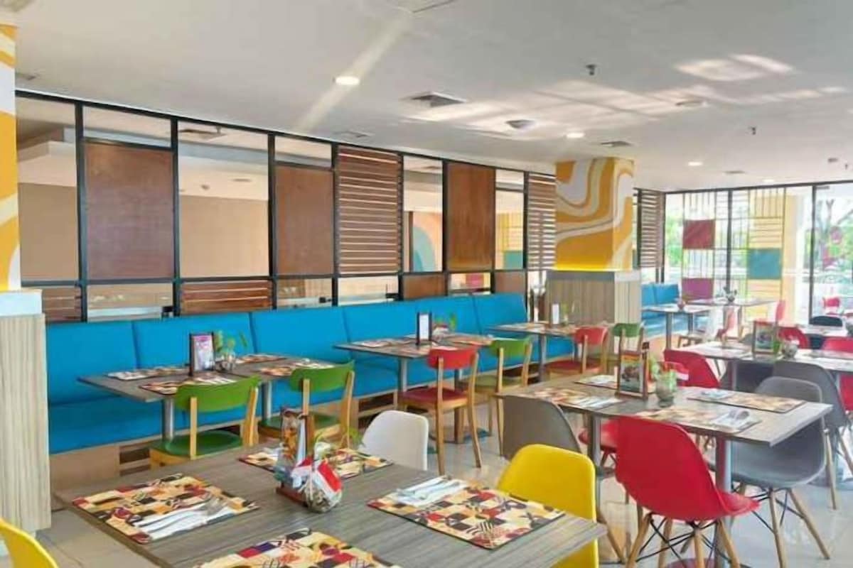 A restaurant with booths and tables, some with menus.