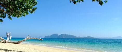On the beach, sun loungers, beach umbrellas, beach towels
