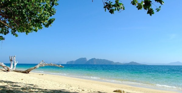 On the beach, sun-loungers, beach umbrellas, beach towels