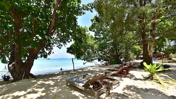 On the beach, sun loungers, beach umbrellas, beach towels