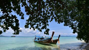 On the beach, sun-loungers, beach umbrellas, beach towels