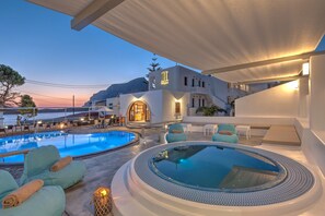 A resort with a swimming pool, a hot tub, and outdoor seating. - Kalypso Studios (Kalymnos)