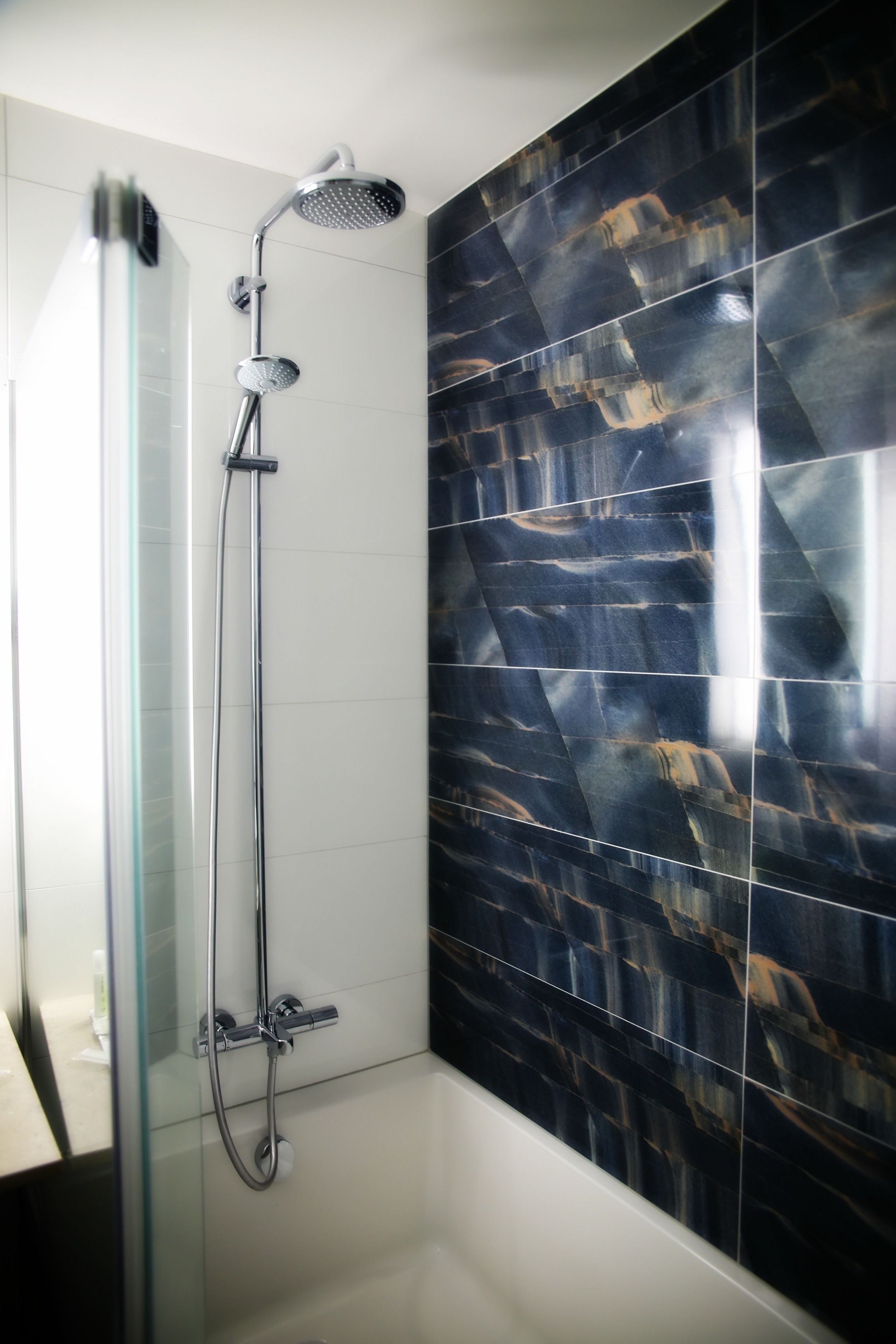 combined shower/bathtub, rainfall showerhead, designer toiletries