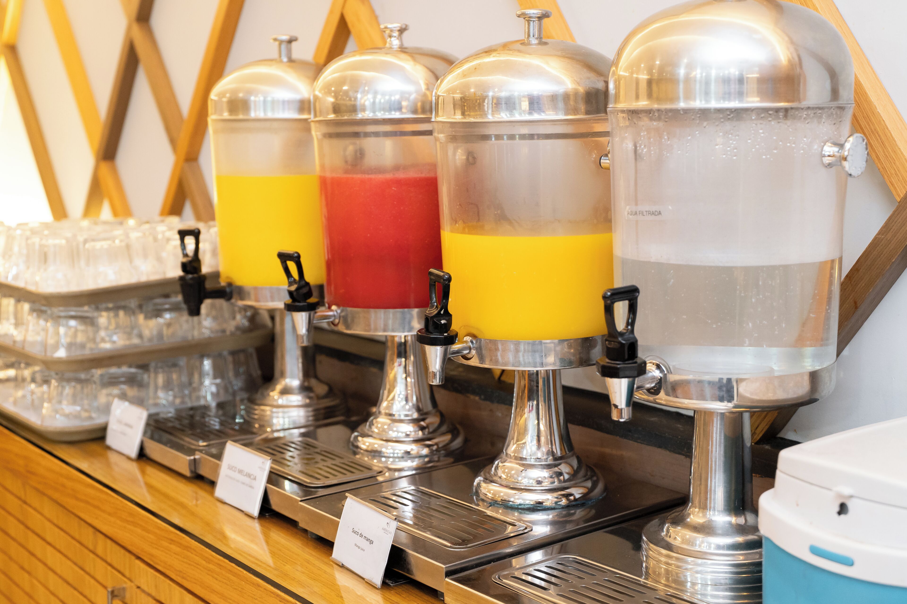 A beverage dispenser station with multiple drink options.