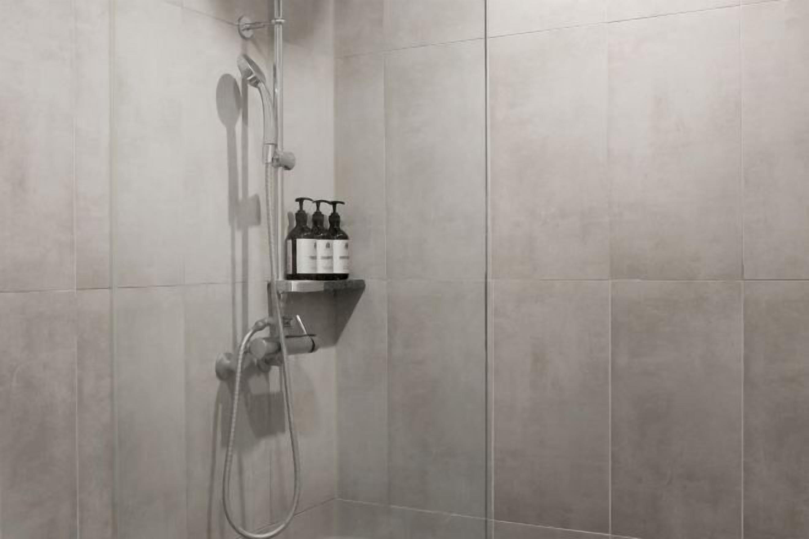 Shower, hair dryer, slippers, towels